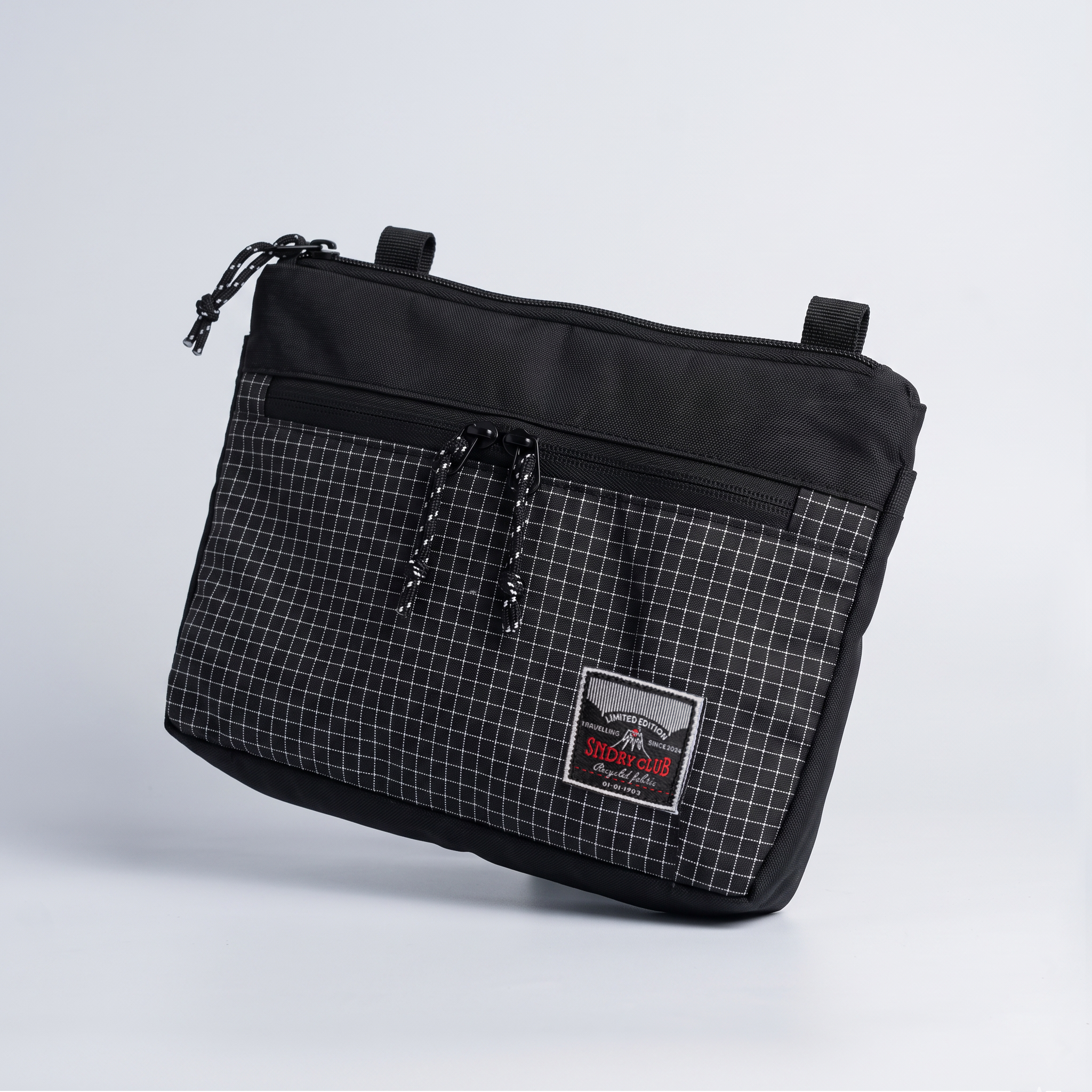Off-Route sling bag by SNDRY CLUB in black recycled ripstop nylon