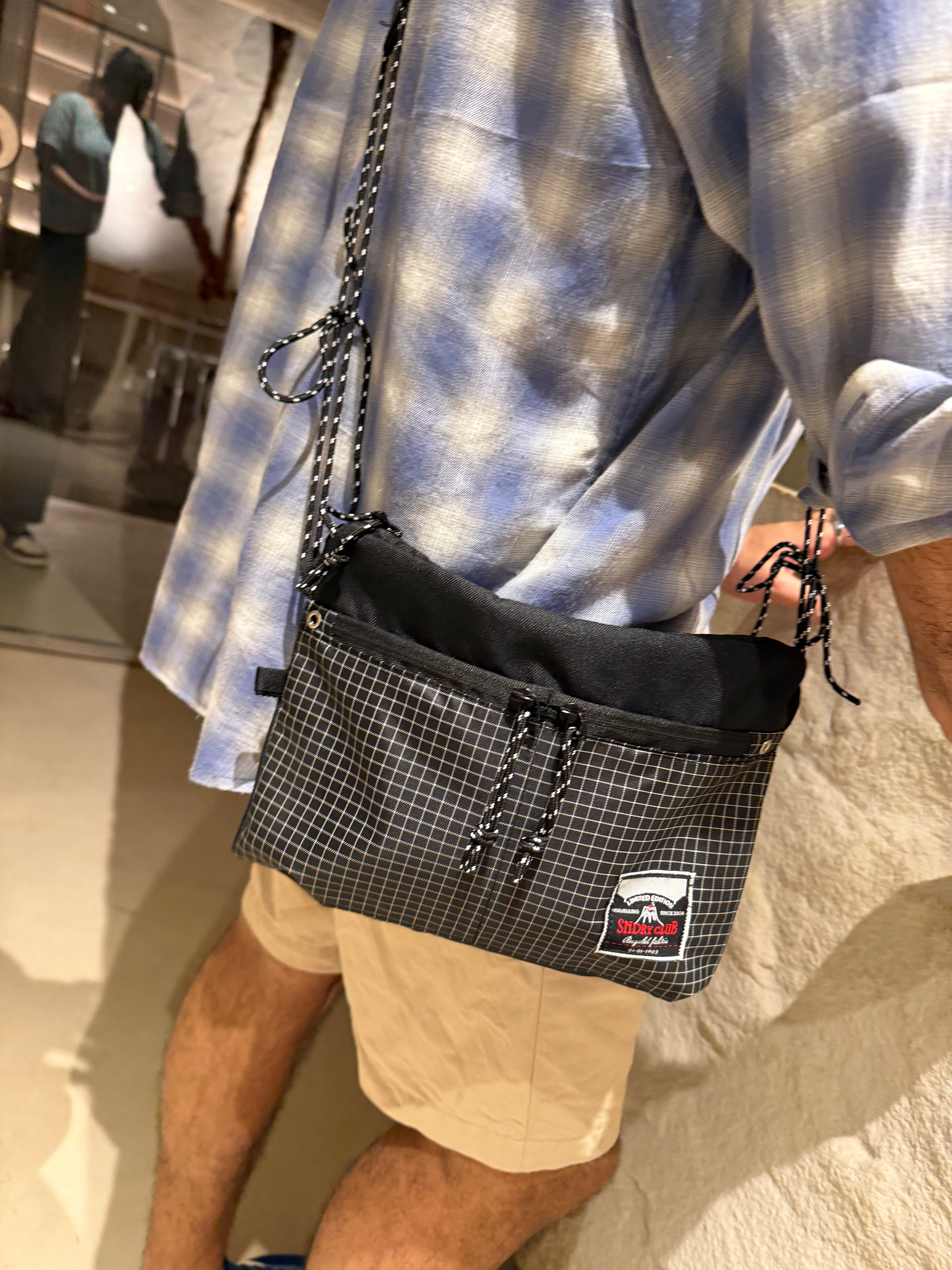 Off-Route sling bag by SNDRY CLUB in black recycled ripstop nylon