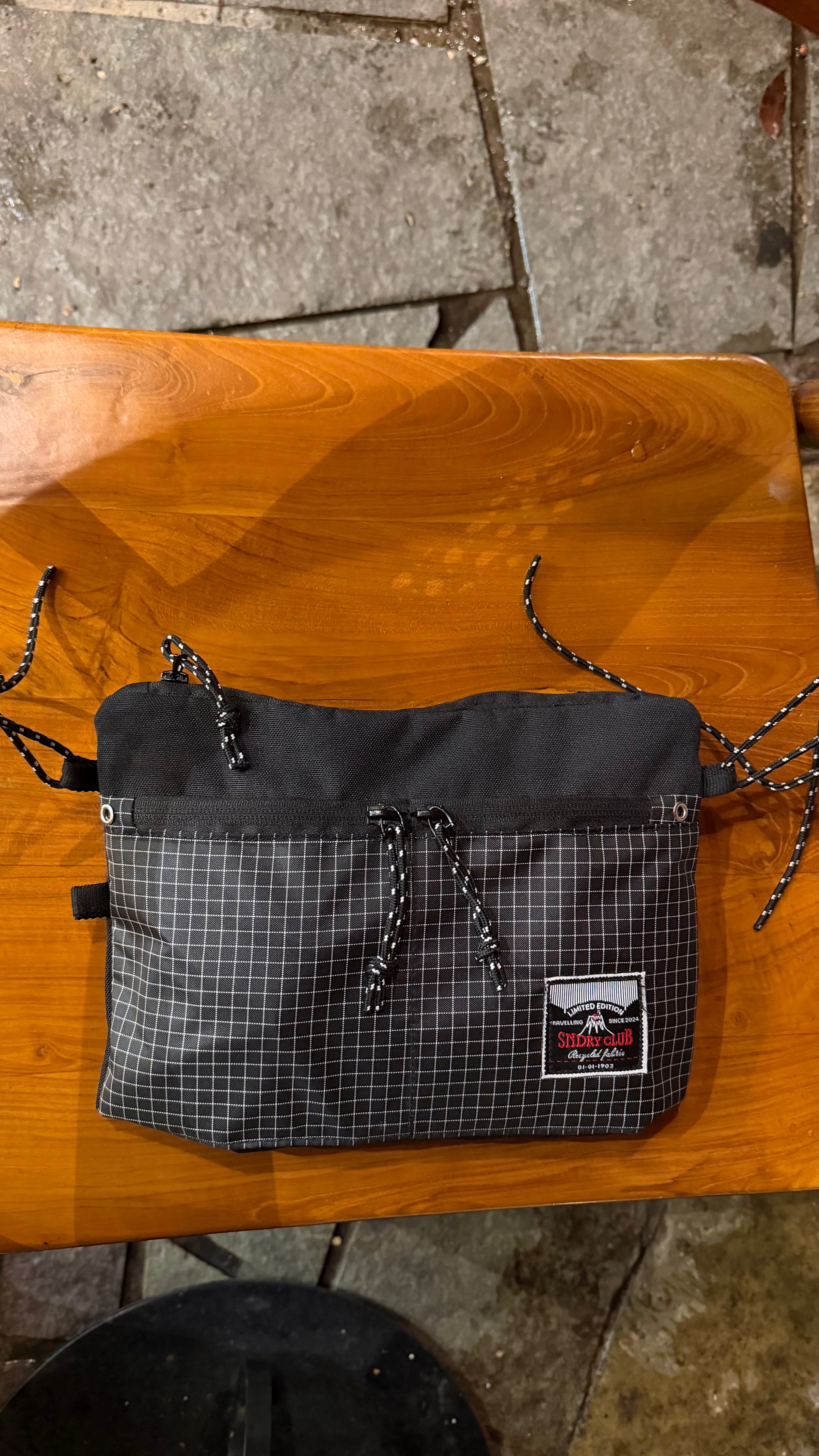 Off-Route sling bag by SNDRY CLUB in black recycled ripstop nylon