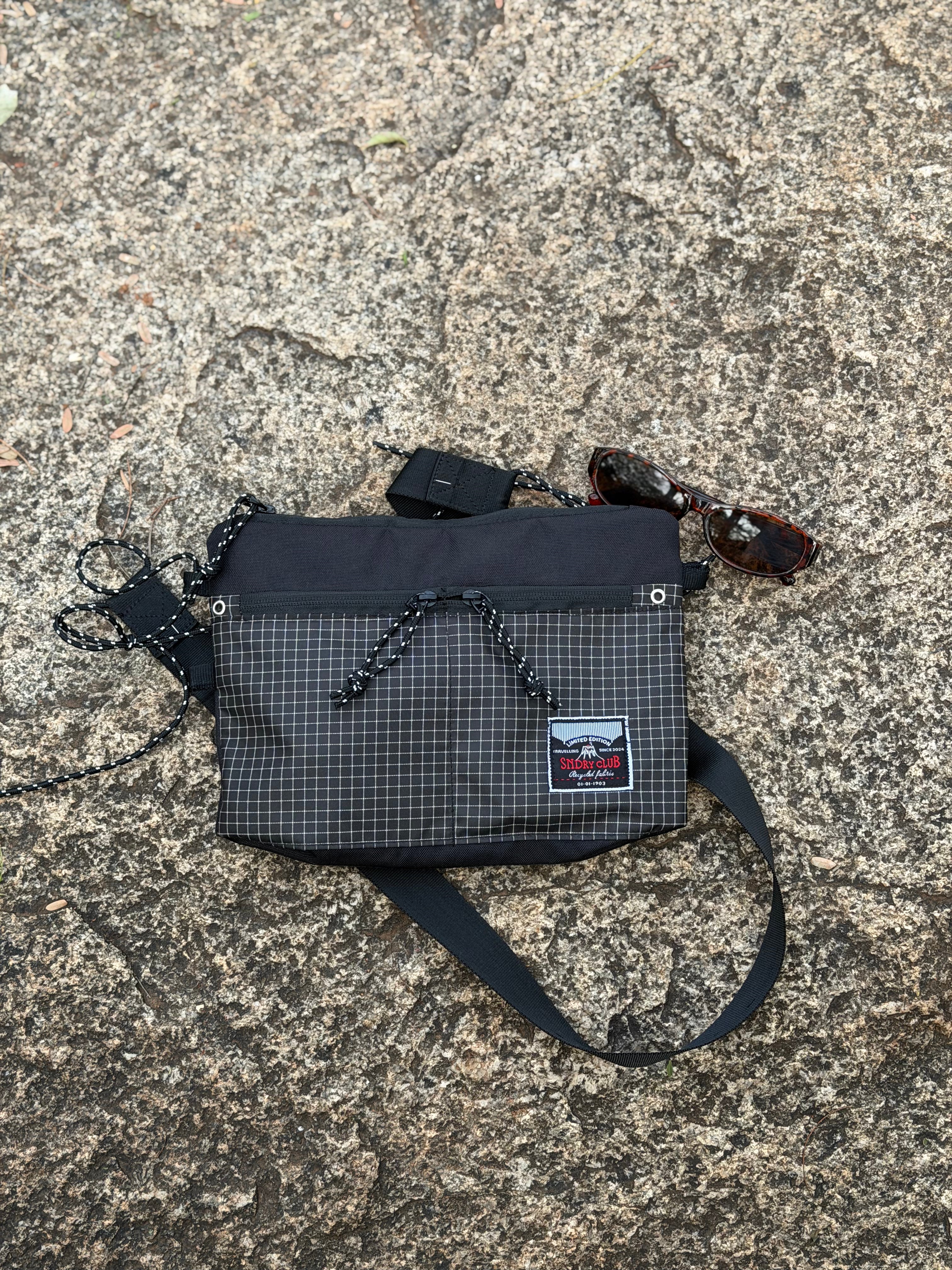 Off-Route sling bag by SNDRY CLUB in black recycled ripstop nylon